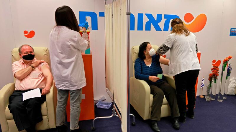 Israelis get vaccinated in Jerusalem. Photograph: Menahem Kahana/AFP via Getty
