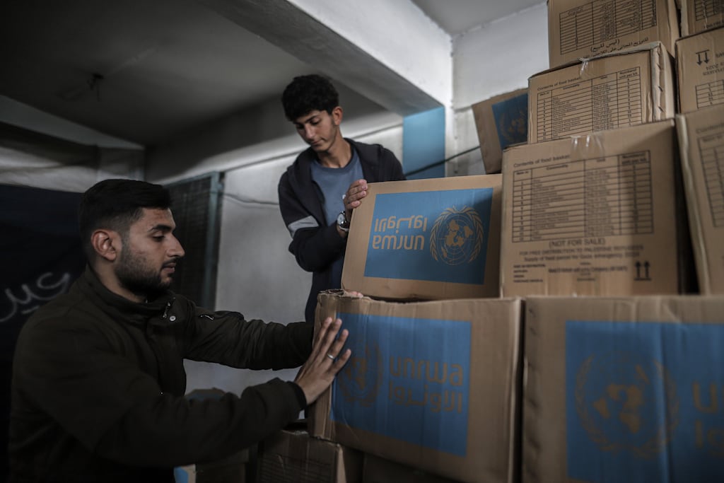 Palestinians arrange food aid packages at an Unrwa warehouse in Deir Al-balah, Gaza, last week.  Photograph: Ahmad Salem/Bloomberg