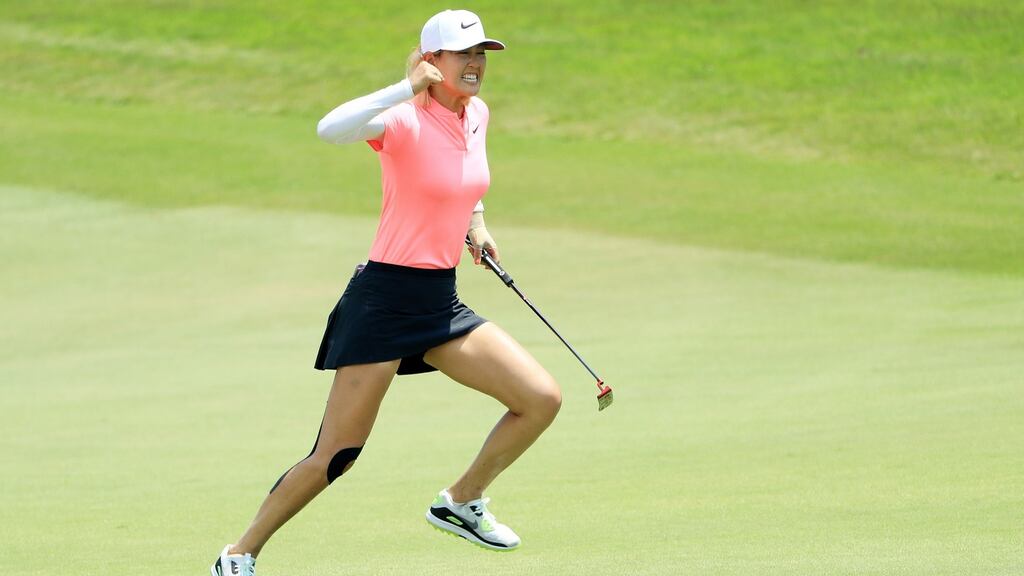 Michelle Wie of the US  celebrating  her birdie on the 18th  on her way to winning  the HSBC Women’s World Championship   in Singapore. Photograph:   Andrew Redington/Getty Images
