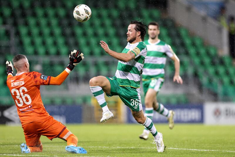 Marc McNulty of Shamrock Rovers and Drogheda United goalkeeper Luke Dennison compete for the ball. Photograph: Laszlo Geczo/Inpho