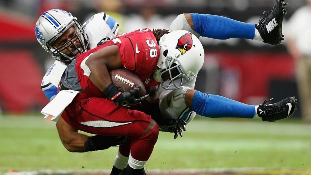 A typical collision in an NFL game. Retired footballers abuse opioid pain pills at a rate more than four times the general population. Photograph: Christian Petersen/Getty Images.