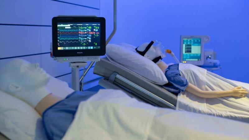 Dummy patients lie within a dummy intensive care unit in the Philips Healthcare showroom operated by the 124-year-old Dutch company Royal Philips