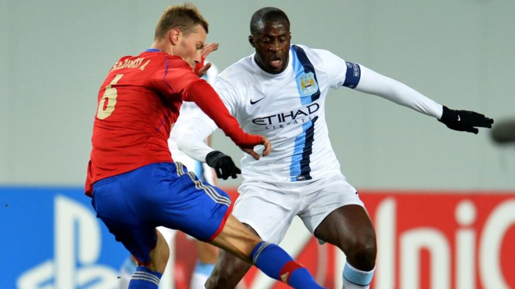 Aleksei Berezutski (left) of PFC CSKA Moscow in action against Yaya Toure of Manchester City  during the UEFA Champions League Group D match at the Arena Khimki Stadium. Photograph:  Epsilon/Getty Images.