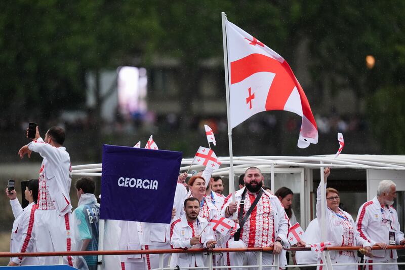 Georgia flagbearers Nino Salukvadze and Lasha Talakhadze and the Georgia team during the opening ceremony of the Paris 2024 Olympic Games in France. Photograph: John Walton/PA Wire