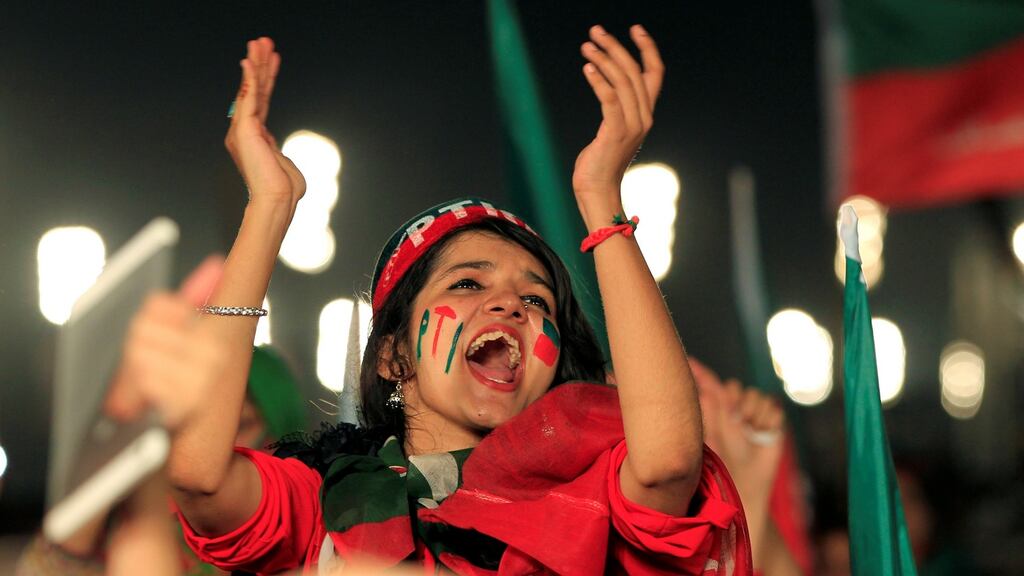 Supporters of Imran Khan, chairman of the Pakistan Tehreek-e-Insaf (PTI) political party,  celebrate the supreme court decision to oust the prime minister Nawaz Sharif. Photograph: Reuters/ Caren Firouz