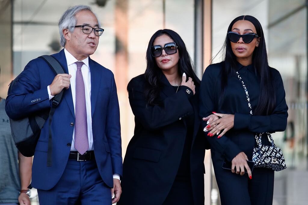 Vanessa Bryant (C), the widow of the late Kobe Bryant, flanked by her trial lawyer, Luis Li (L), and friend, Sydney Leroux (R), leaves a federal courthouse in Los Angeles, California. Photograph:Caroline Brehman/EPA