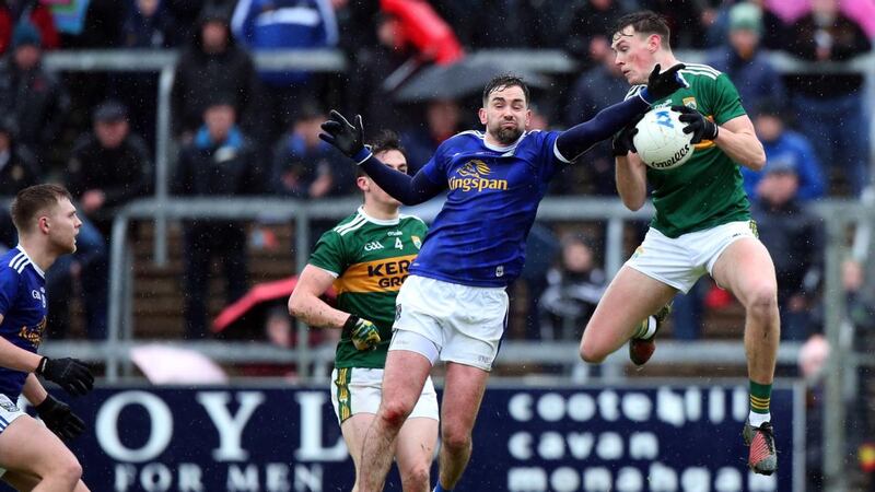 Kerry’s Gavin O’Brien claims the ball ahead of Cavan’s Niall Murray during the Allianz Football League Division 1 match at Kingspan Breffni Park. Photograph: John McVitty/Inpho