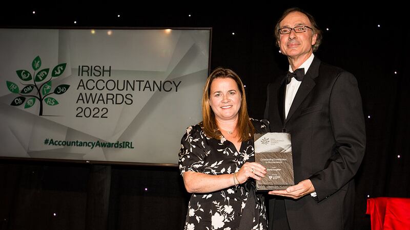 Barry Dempsey, chief executive, Chartered Accountants Ireland, presents the Outstanding Contribution to Accountancy award to Elaine Coughlan.