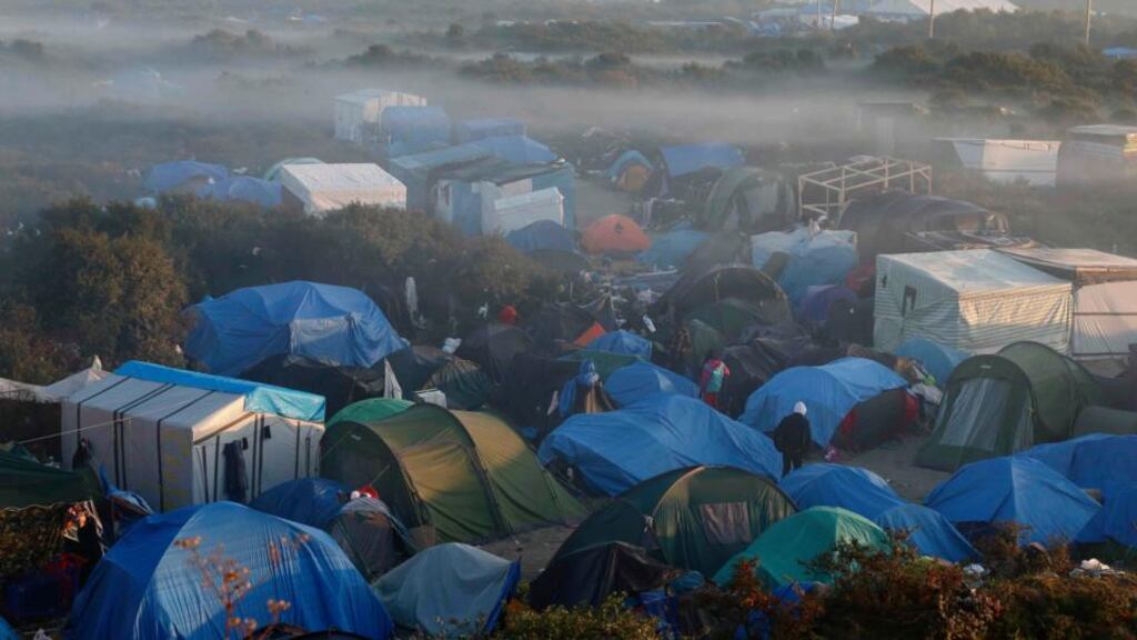 Fog hangs above tents and makeshift shelters in a field where migrants and asylum seekers stay in Calais, France, October 2nd 2015. Most of the unaccompanied minors arrived in Ireland from Calais or Greece Photograph: Pascal Rossigno/Reuters