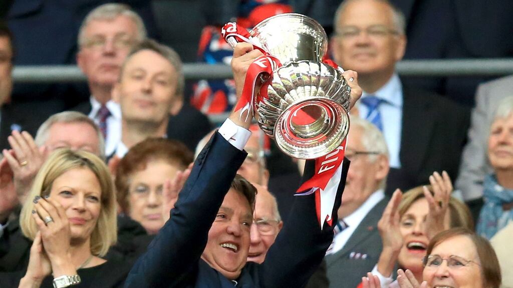 Manchester United manager Louis Van Gaal lift the FA Cup in what is expected to be his last game in charge of the club. Photograph: Mike Egerton/PA Wire.
