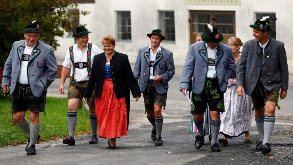 Voters in traditional dress arrive to cast their ballots yesterday in the Bavarian state elections in Haunshofen. Irish commentators’ reactions to the euro crisis confirm that we need to get past German stereotypes. Photograph: Reuters/Michael Dalder