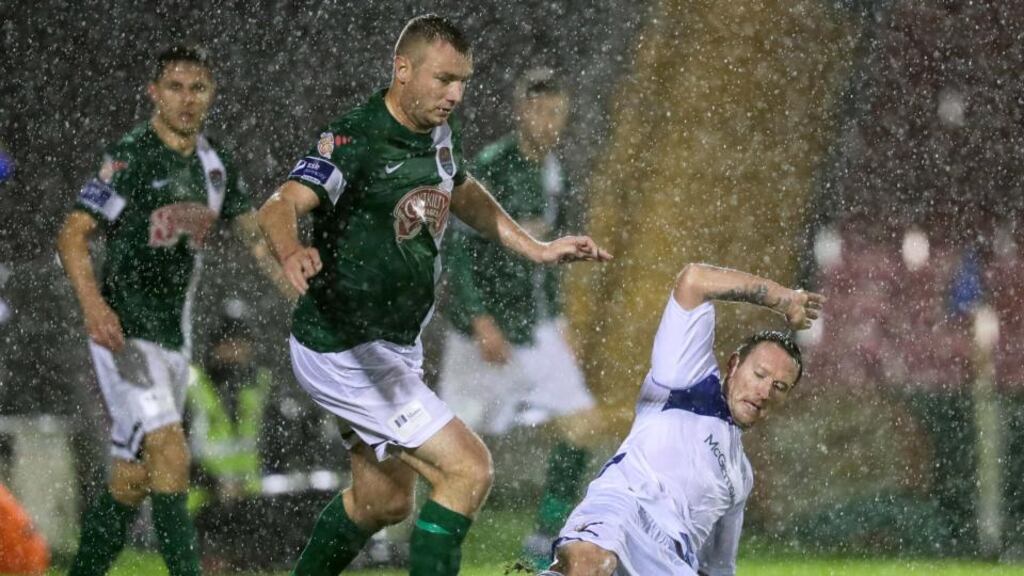 Cork’s Kenny Browne with Barry Molloy of Finn Harps during their Airtricity League clash at Turner’s Cross. Photo: Inpho