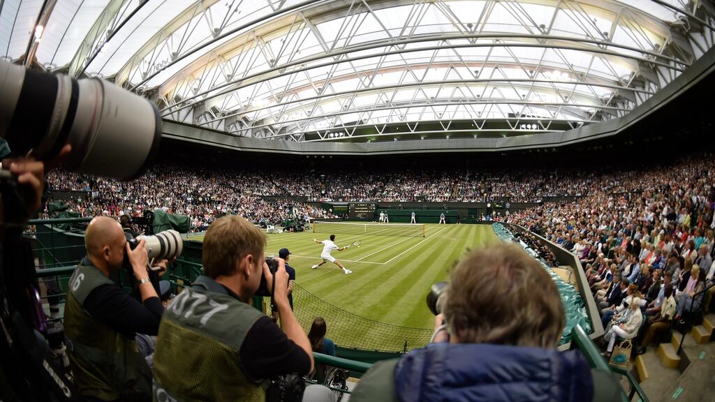 Novak Djokovic returns service against Adrian Mannarino during their second-round match at Wimbledon. Photograph: Hannah McKay/EPA