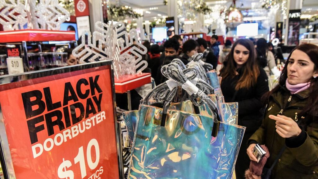 People shopping on Black Friday at Macy’s in New York. Photograph: Stephanie Keith