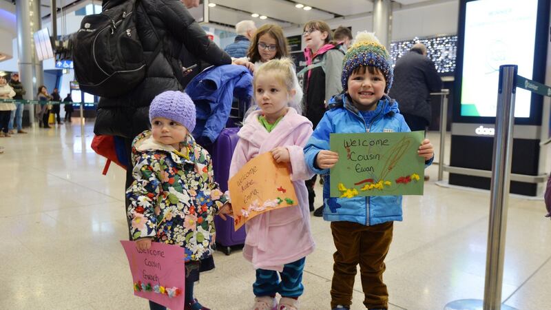 Emilia, Zola and Lachlan waiting for their aunt and uncle Emma and Jason Larson to arrive. Photograph: Alan Betson / The Irish Times