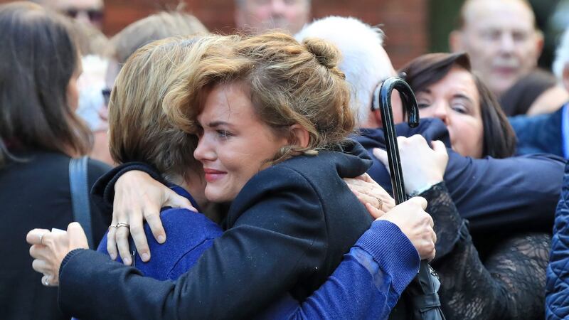 Family members console each other at the funeral of sports broadcaster Jimmy Magee. Photograph: Colin Keegan/Collins Dublin.