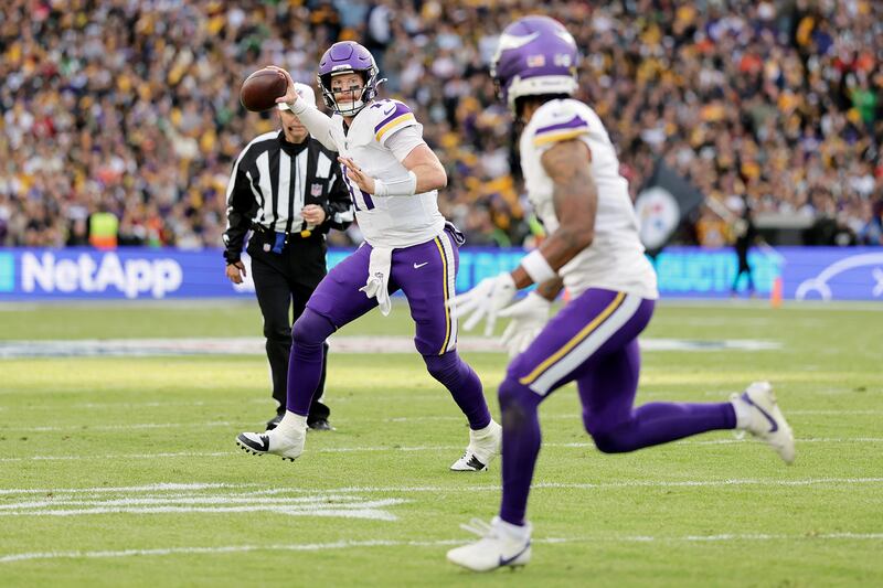 Minnesota quarterback Carson Wentz throws a touchdown pass to wide receiver Jalen Nailor. Photograph: Laszlo Geczo/INPHO