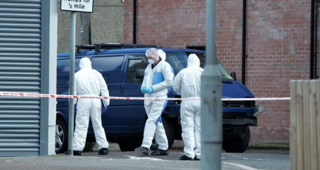PSNI forensic officers inspect the damaged van following a car bomb attack on a prison officer in Belfast. Photograph: Charles McQuillan/Getty Images