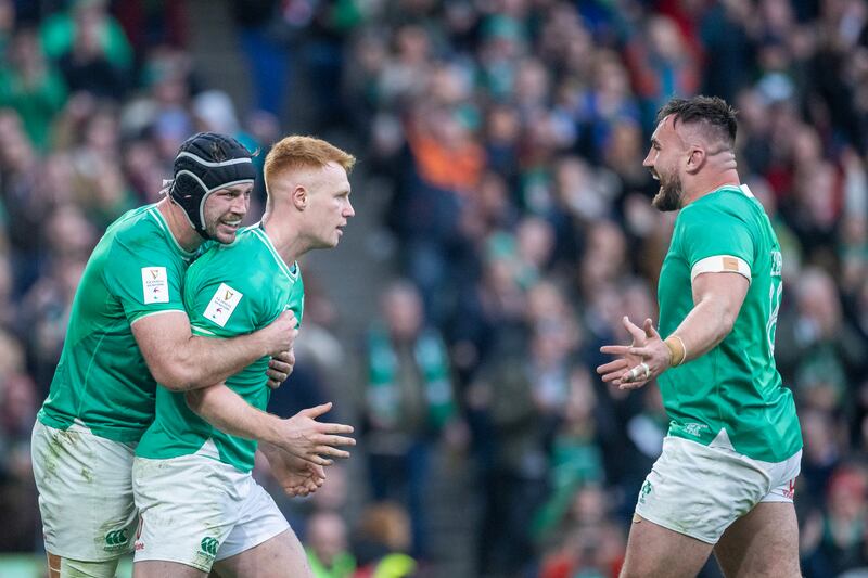 Ireland's Ciaran Frawley celebrates after scoring a try as Caelan Doris and Ronan Kelleher congratulate him during the Six Nations game against Wales at the Aviva Stadium in February. Photograph: Tim Clayton/Corbis via Getty Images