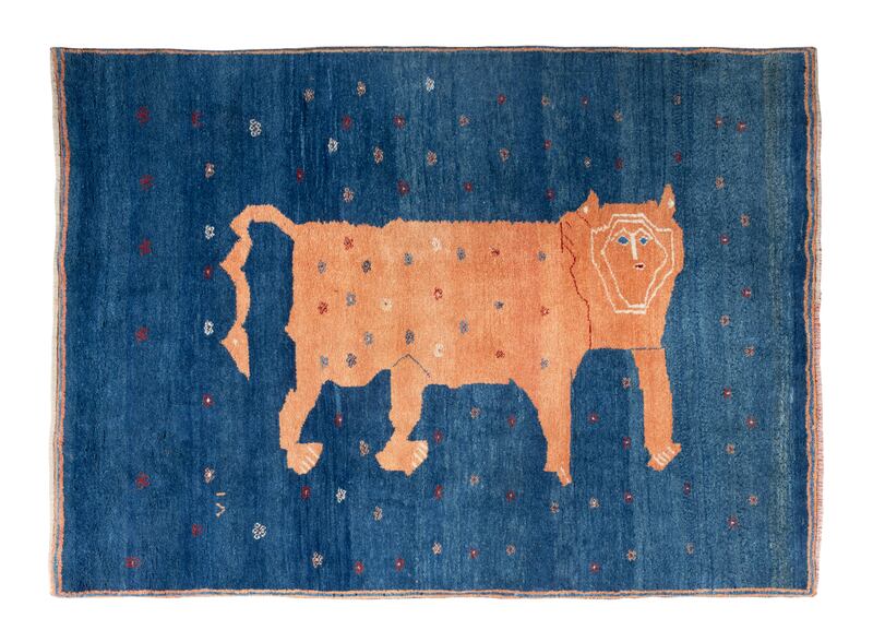 A Middle Eastern wool rug with the large standing lion