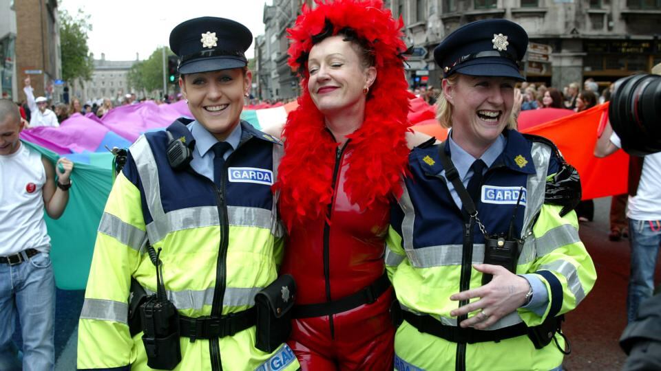 On parade: two members of the Garda get caught up in the 2005  Gay Pride march. Photograph: Fran Veale