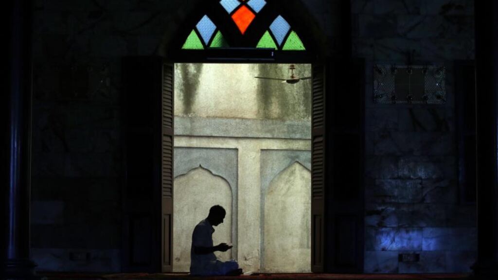 An Indian Muslim offers prayers inside a mosque during the first day of the fasting month of Ramadan in Mumbai yesterday. During Ramadan, Muslims refrain from eating, drinking and smoking from dawn to dusk. Photograph: Divyakant Solanki/EPA