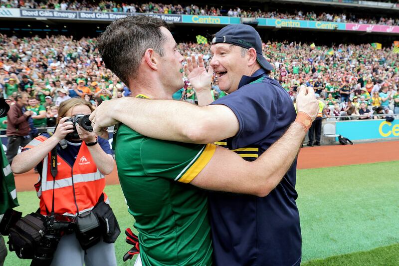 Meath manager Robbie Brennan celebrates after the game with Donal Keogan. Photograph: Laszlo Geczo/Inpho