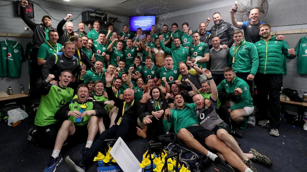 The Ireland players, with head coach Joe Schmidt in the back row, and staff celebrate in the dressing room after Saturday’s win over Australia sealed a first series victory against the Wallabies since 1979. Photograph: Dan Sheridan/Inpho