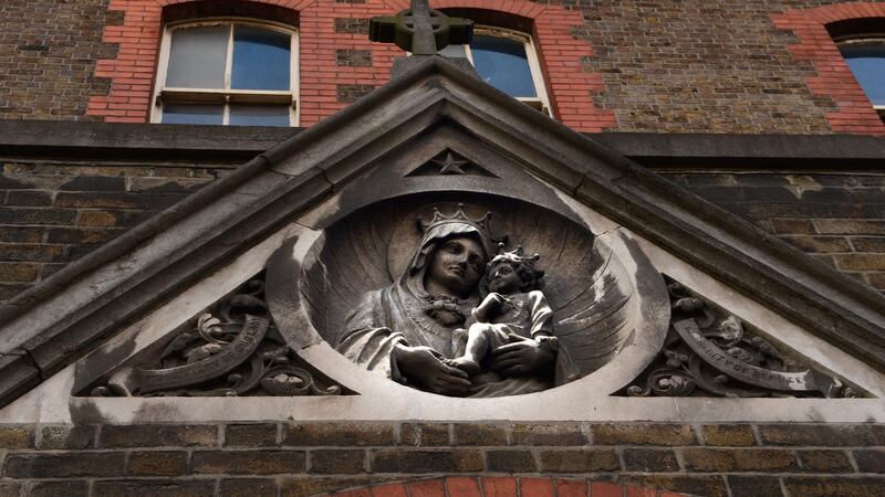 A Virgin and child carving in stone over the door of the Magdalen Laundry on Gloucester Street, Dublin. Photograph: Cyril Byrne
