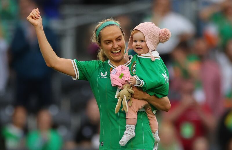 Ireland’s Julie-Ann Russell celebrates with her daughter Rosie after the win over France. Photograph: James Crombie/Inpho