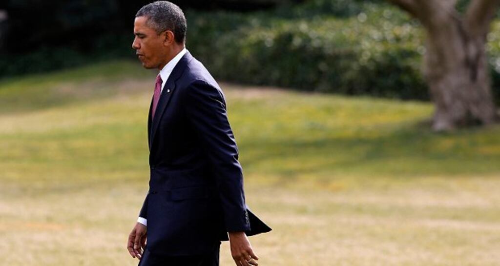 US President Barack Obama walks on the south lawn in the White House. Photograph: Larry Downing/Reuters