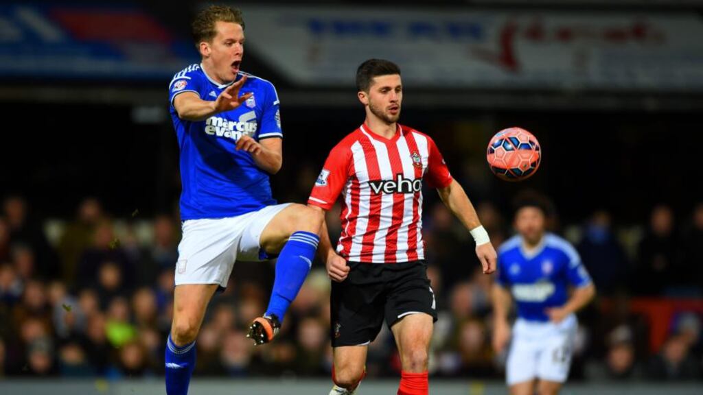 Southampton striker Shane Long battles with Christophe Berra of Ipswich Town during the FA Cup third-round match at Portman Road. Photograph: Shaun Botterill/Getty Images