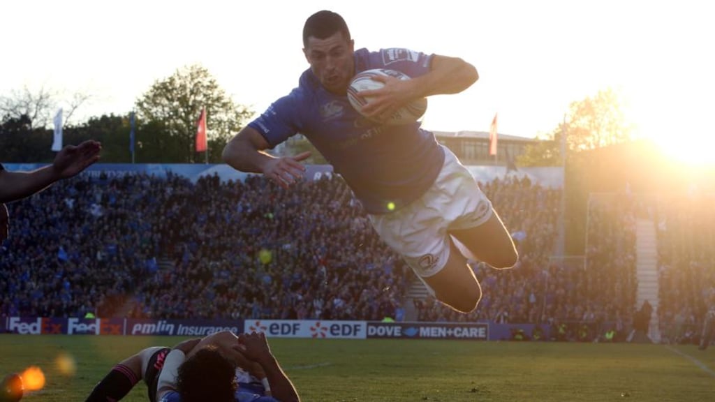 Rob Kearney leaps in to score the third of Leinster four tries against Stade Francais. Photograph: Inpho