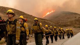 LA fires: Calmer winds help firefighters as death toll hits 10