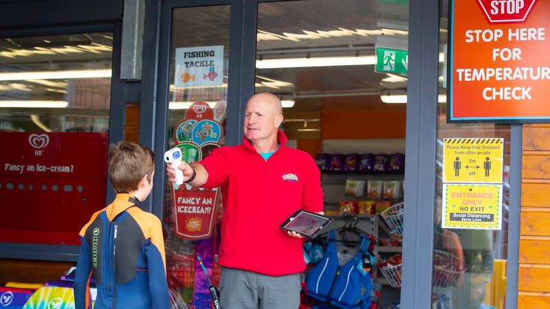 Rupert Musgrave taking temperature readings at a summer camp at Dunmore Adventure Centre, Dunmore East, Co Waterford, in June. Photograph: Patrick Browne