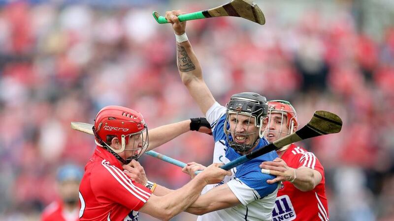 Cork’s Bill Cooper and Stephen O’Donnell challenge Waterford’s Maurice Shanahan during the Munster SHC semi-final at Semple Stadium in Thurles. Photo: James Crombie/Inpho
