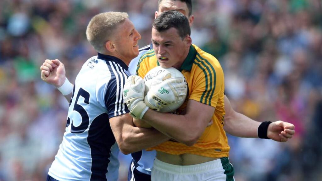 Meath goalkeeper Paddy O’Rourke holds on tight as Eoghan O’Gara and Diramuid Connolly move in in last year’s Leinster final at Croke Park. Photograph: Donall Farmer/Inpho