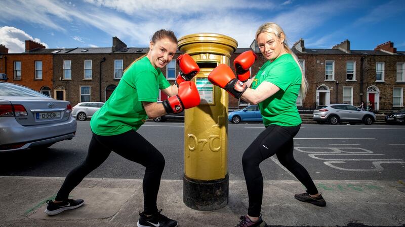 A postbox covered in gold to honour boxer Kellie Harrington in Summerhill Parade, Dublin. Stacey Spain and Francesca Arkins celebrate it. Photograph: Tom Honan