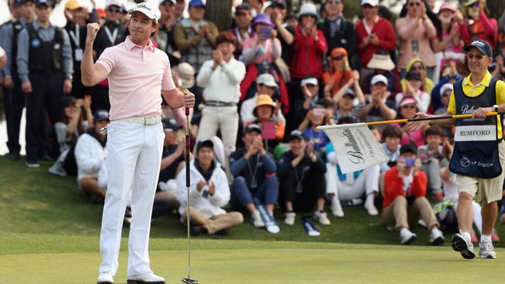 Brett Rumford of Australia celebrates after holing an eagle putt at the first play-off hole to win the Ballantine’s Championship at Blackstone Golf Club in Icheon, South Korea. Photograph: Andrew Redington/Getty Images