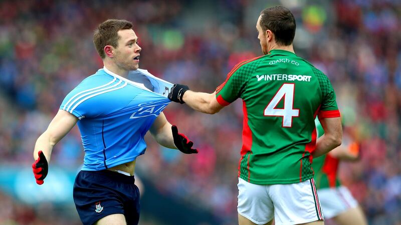 Dublin’s Dean Rock and Keith Higgins of Mayo. Photo: James Crombie/Inpho