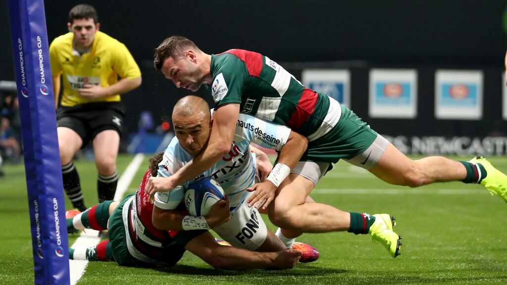 Leicester Tigers’s Jonah Holmes and Jonny May prevent Simon Zebo of Racing 92 from scoring during their Champions Cup clash. Photo: James Crombie/Inpho