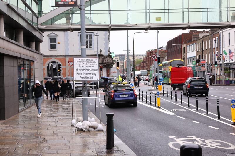 A sign at the junction of Westland Row and Pearse Street in Dublin city centre spells out the new reality - no left turn as of May 25th for private traffic. Public transport, taxis and cyclists can still turn left. Photograph: Dara Mac Dónaill/The Irish Times