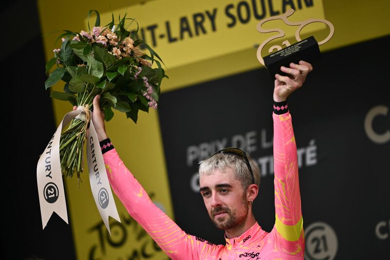 Irish rider Ben Healy celebrates on the podium with the most combative rider's award after the 14th stage of the 2024 Tour de France. Photograph: Marco Bertorello/AFP via Getty Images
