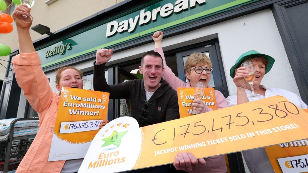 Owner Les Reilly celebrates with his niece Carly Reilly Flynn (L) and staff Martina White and Anne Morgan (R) at the Reilly’s Daybreak shop in The Naul, after selling a winning ticket. Photograph: Colin Keegan/Collins