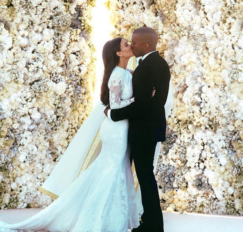 Kim Kardashian West and Kanye West kissing at their wedding in Florence, Italy. File photograph: E! News/PA Wire