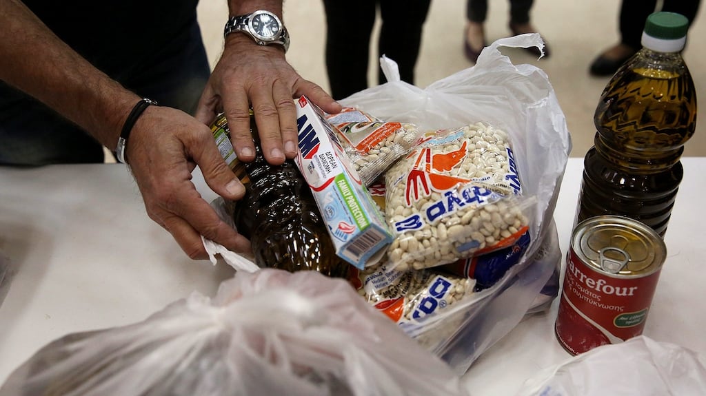 A bag of supplies for a poor resident of Athens, Greece. Some 36% of Greeks are living near the poverty line, something that also applies to 37% of Romanians and 41% of Bulgarians. Photograph: EPA/Orestis Panagiotou