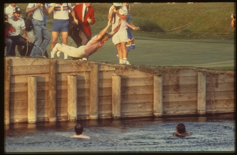 Jerry Pate jumps into the water on the 18th after winning the 1982 Players Championship. He had already pushed in PGA Tour commissioner Deane Beman and Sawgrass course designer Pete Dye. Photograph: Bill Knight/PGA Tour Archive via Getty Images