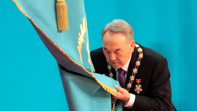 Kazakh president Nursultan Nazarbayev kisses the national flag during a swear-in ceremony in Astana. File photograph: Alexey Filippov/AFP/Getty Images
