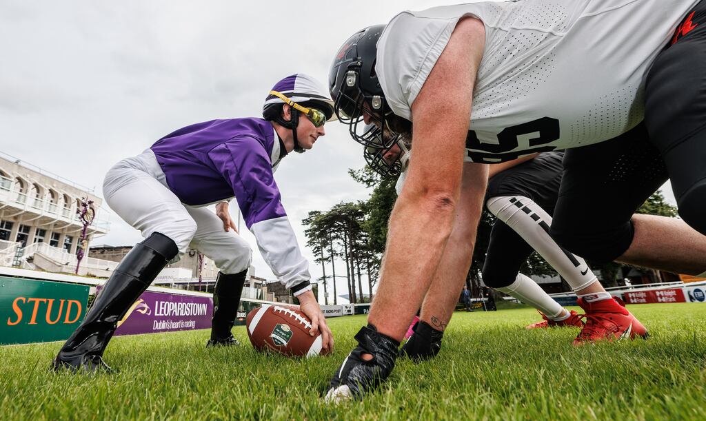 Jockey Cillian McConnell lines out with Dublin Rebel players Evan Allen and Greg John to promote Horse Racing Ireland's partnership with the Aer Lingus College Football Classic. Photograph: James Crombie/Inpho