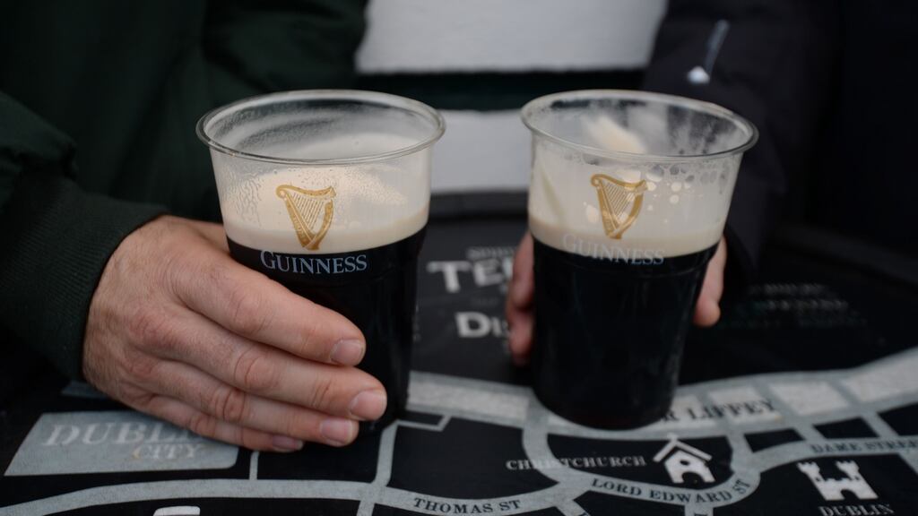 People enjoy takeaway pints in Dublin’s Temple Bar at the weekend. Photograph: Alan Betson / The Irish Times